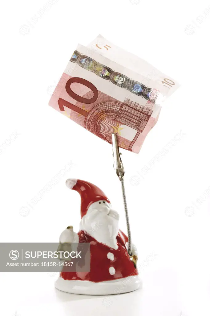 Santa Claus Figurine holding Euro note