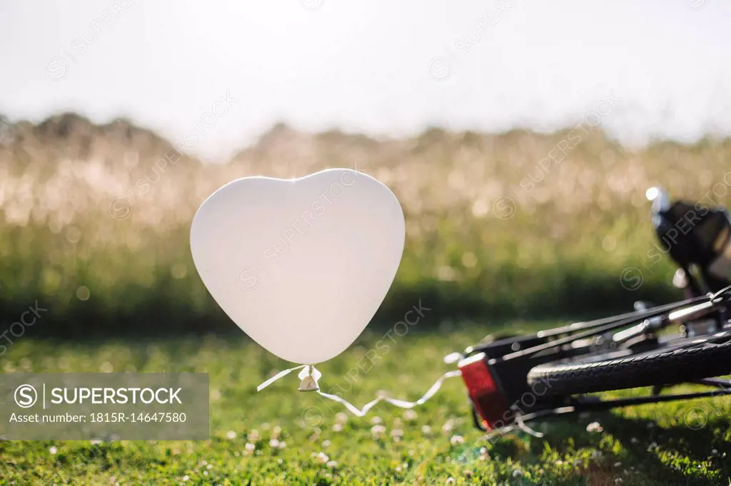 Bicycle and white balloon
