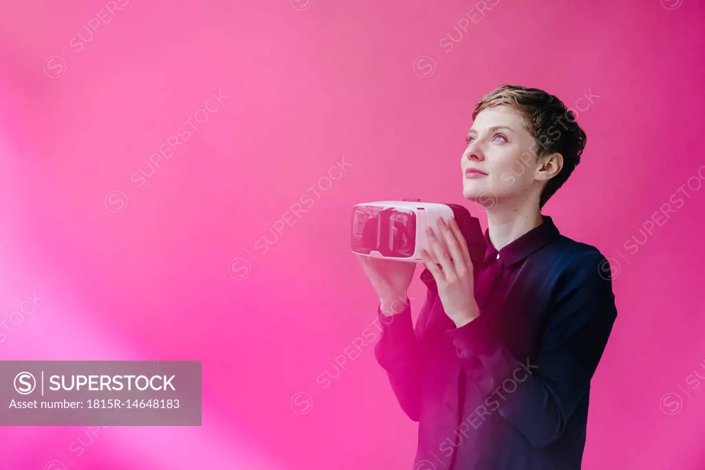 Woman holding VR glasses