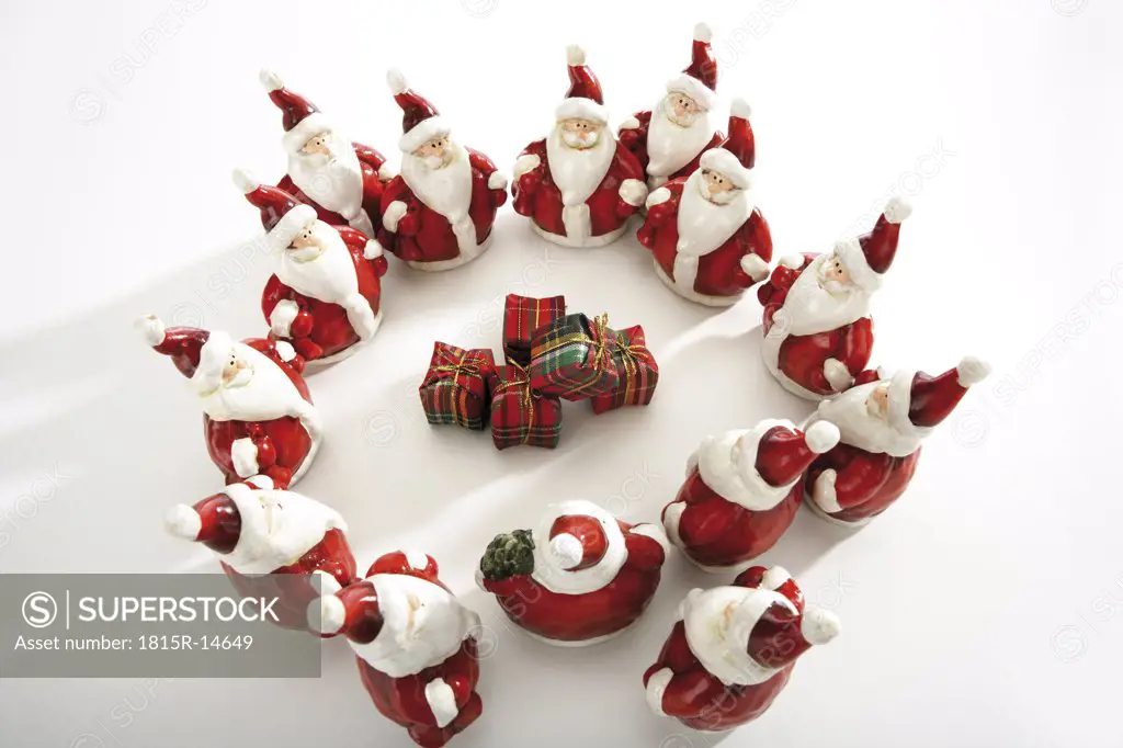 Santa Claus figurines standing in circle