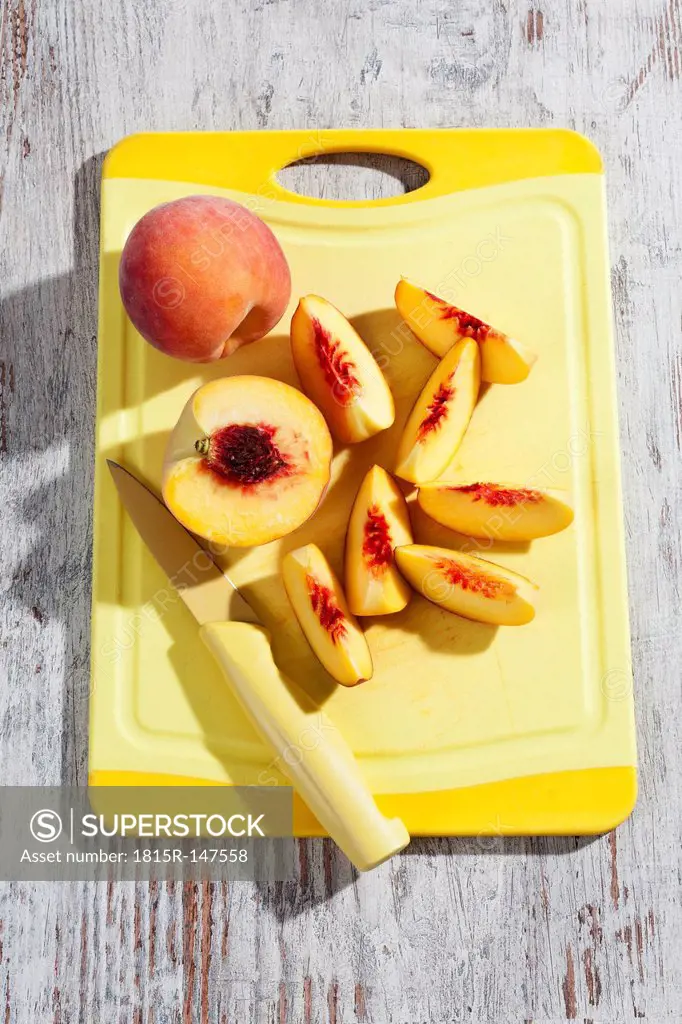 Peaches on cutting board