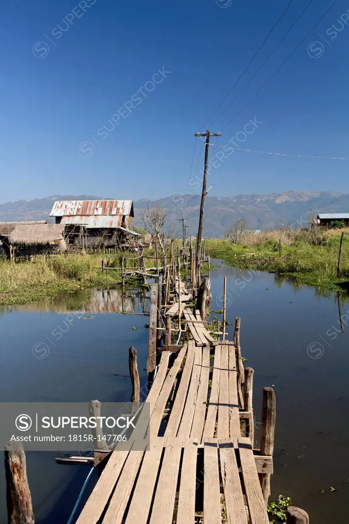 Myanmar, View of fishing village and wooden path at Lake Inle