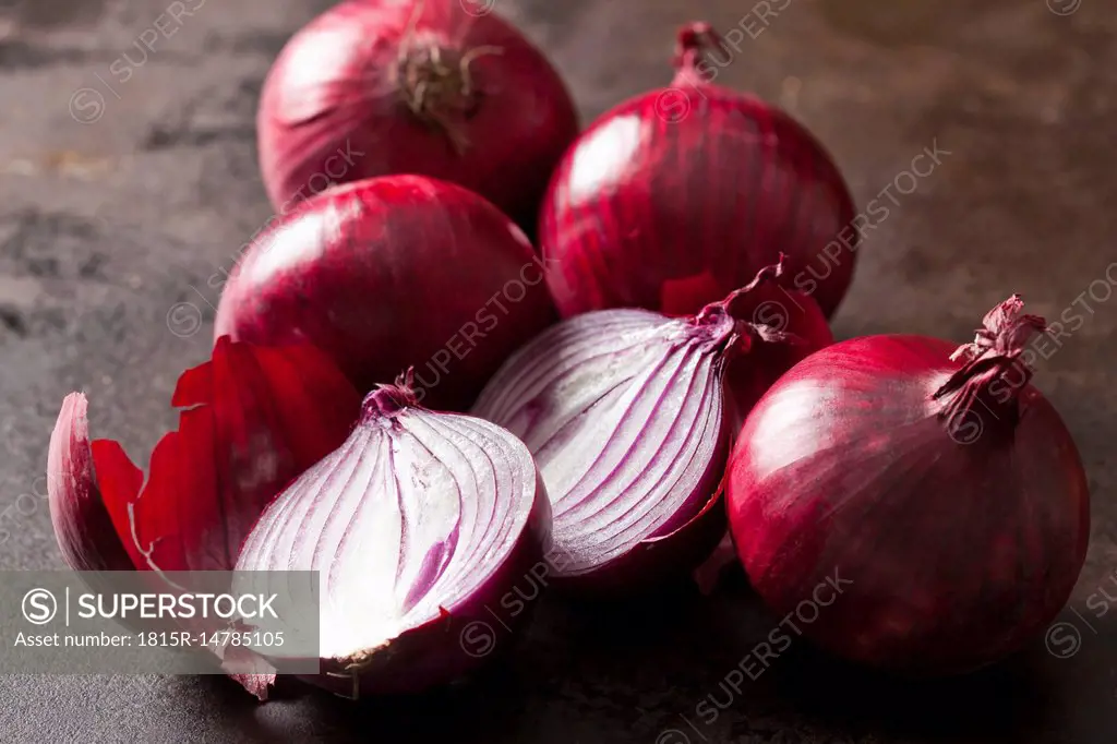 Whole and sliced red onions