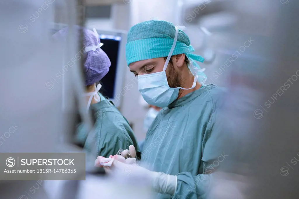Surgical nurse at work during an operation