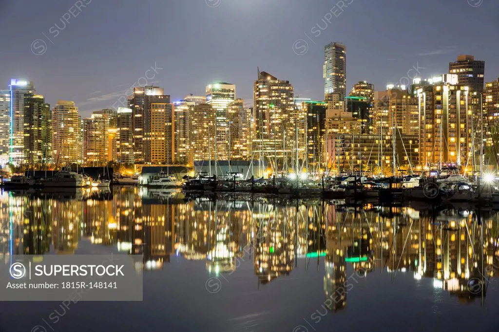 Canada, Vancouver, Marina with ships and skyline at night