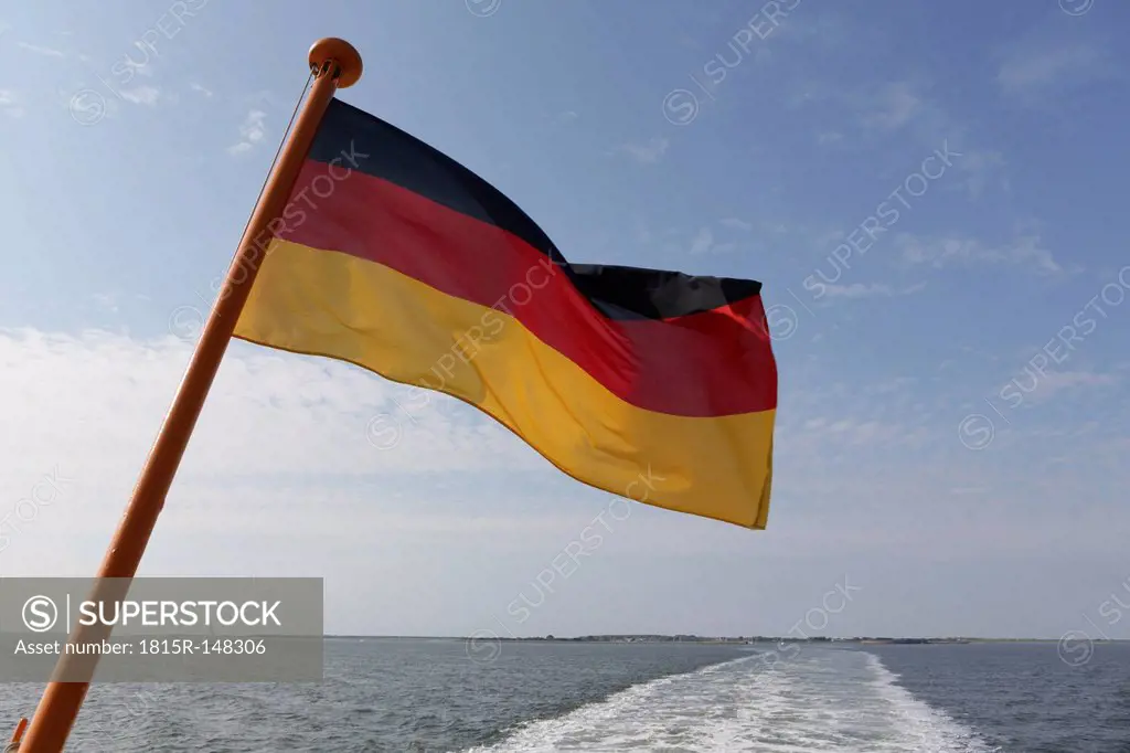 Germany, Lower Saxony, East Frisia, Langeoog, ferry boat with German flag