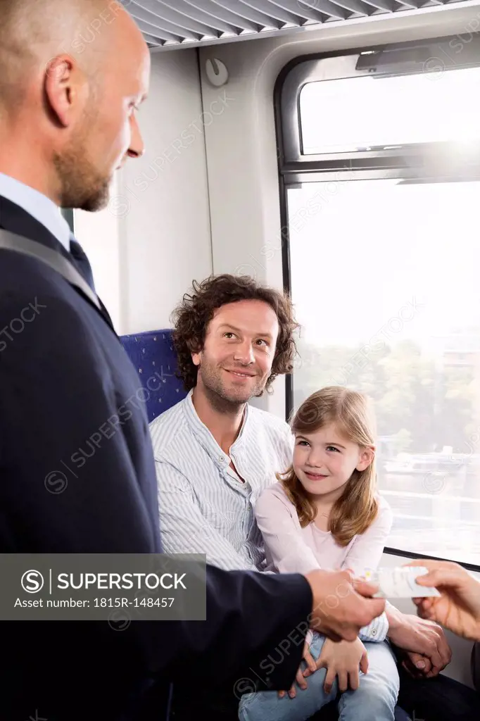 Conductor and family in a train