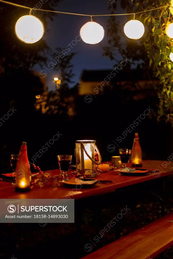 Laid table in garden at night