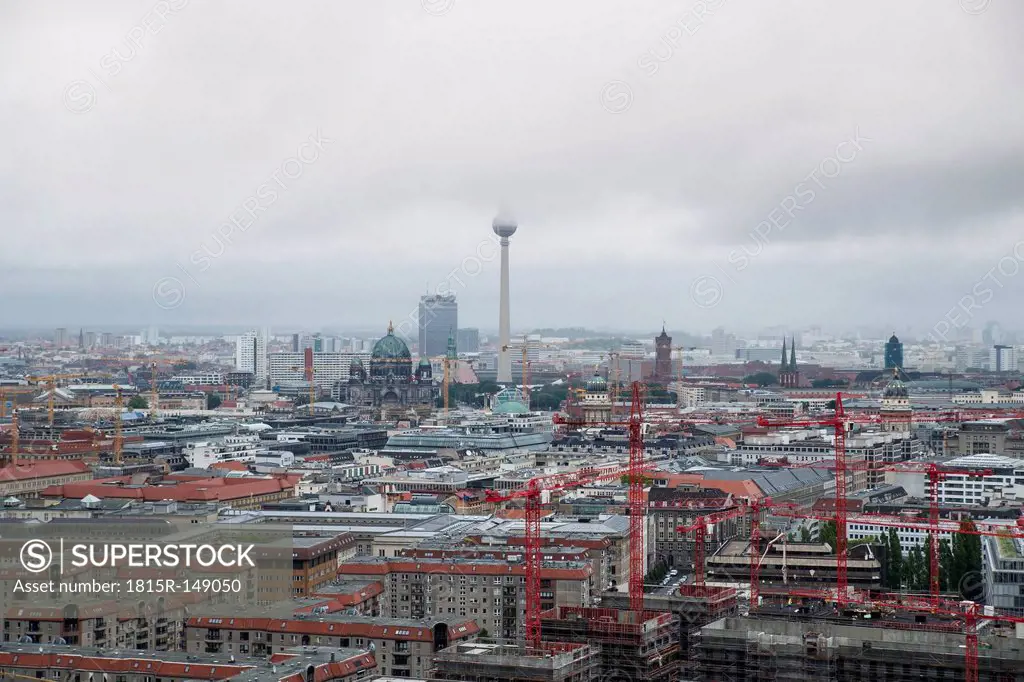 Germany, Berlin, view to television tower, construction cranes in front