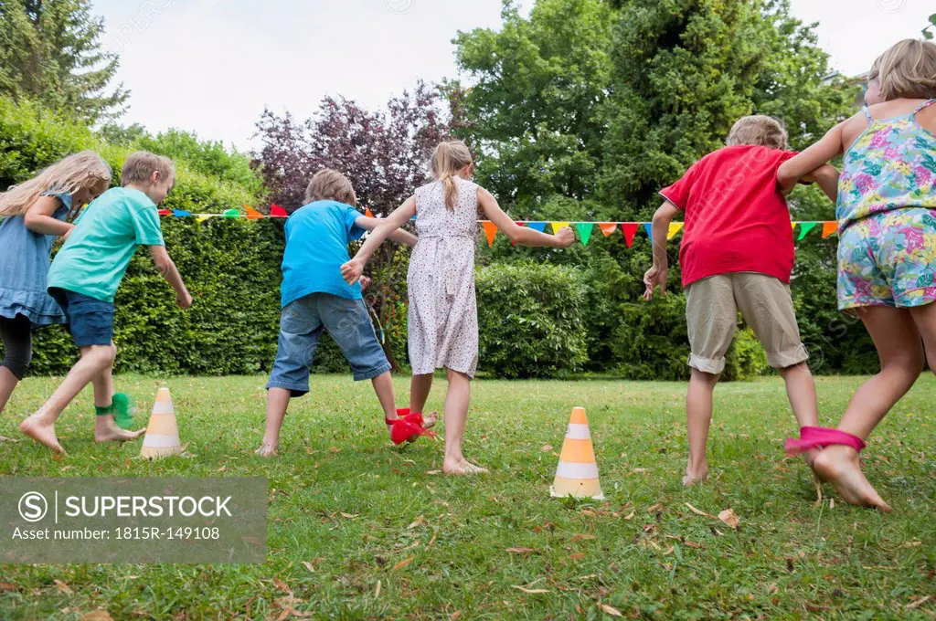 Children playing in garden on a birthday party
