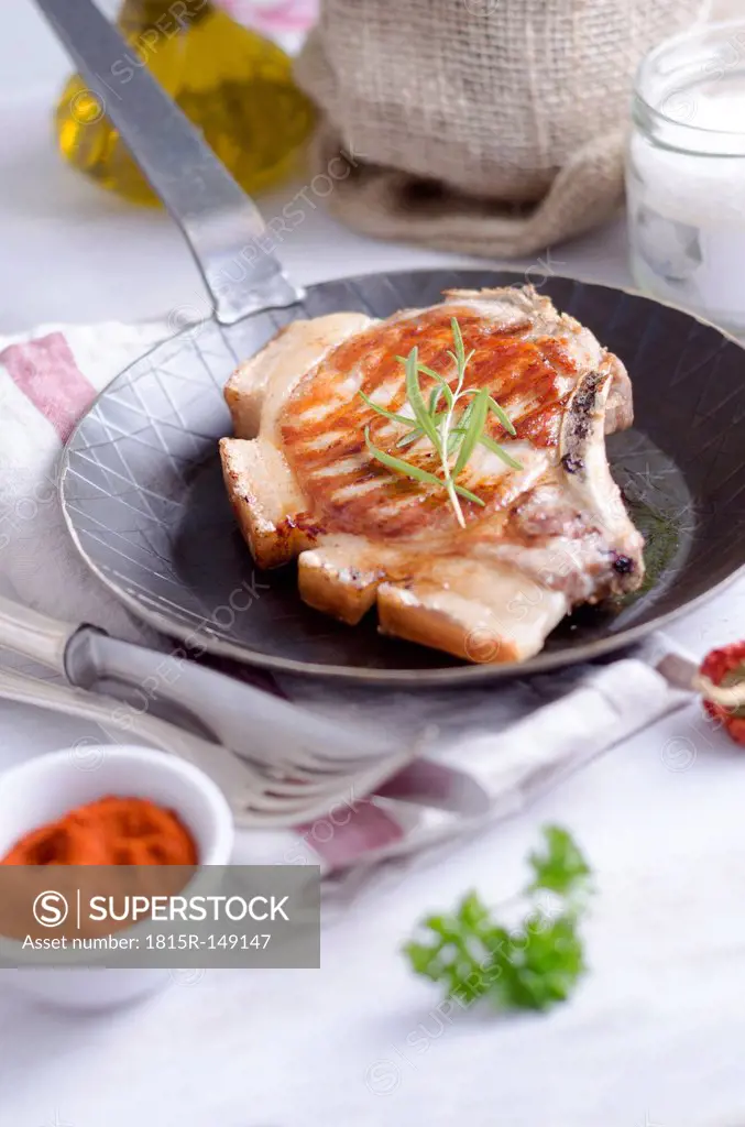 Pork chop in frying pan