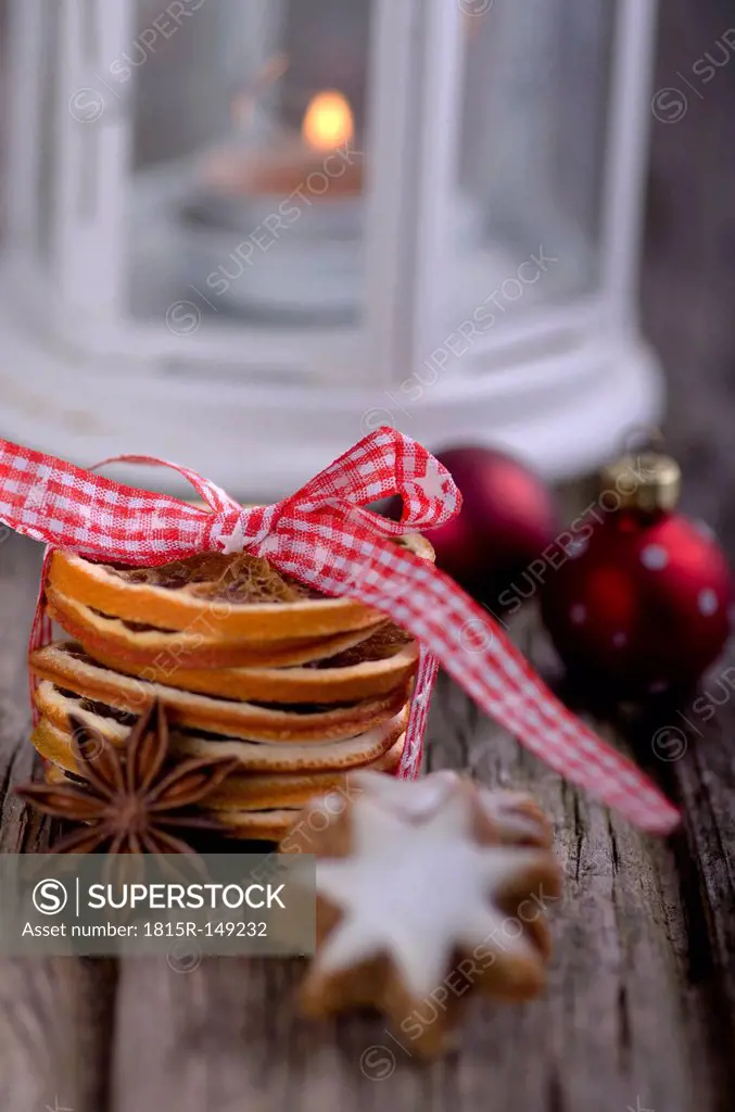 Star anise and orange cest with Christmas decoration on wood table