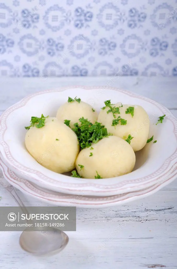 Potato dumplings with parsley in a bowl