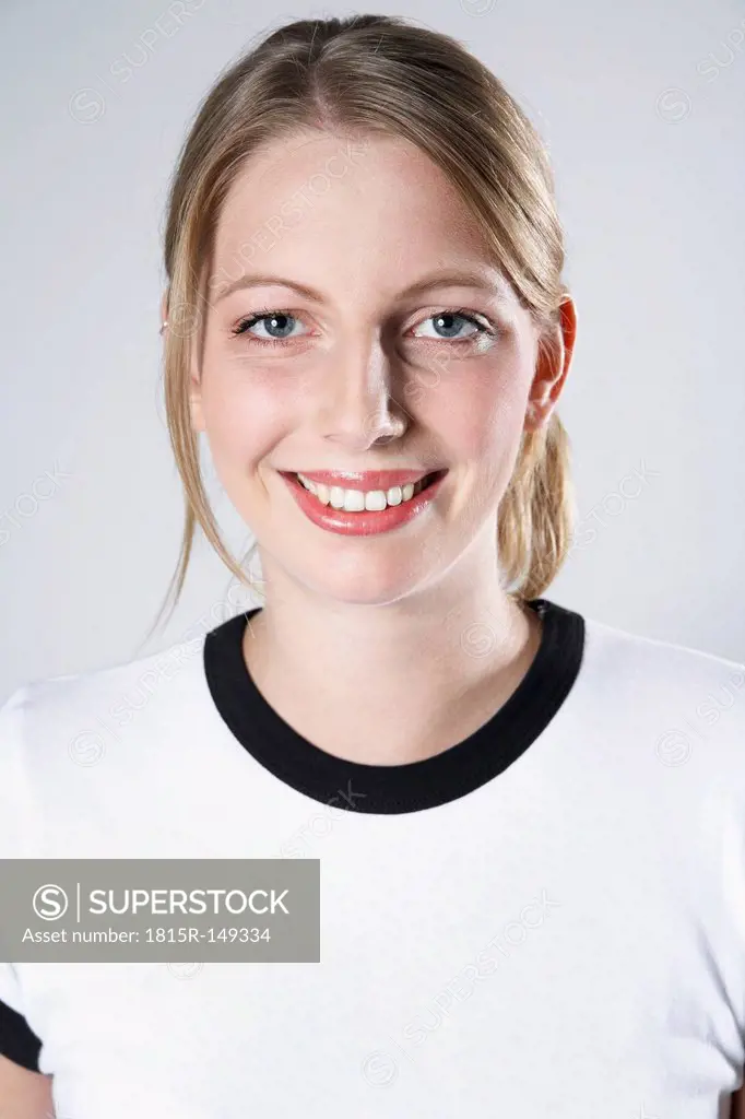 Smiling woman wearing soccer jersey