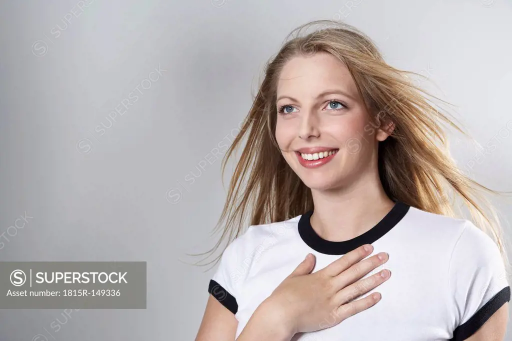 Smiling woman wearing soccer jersey