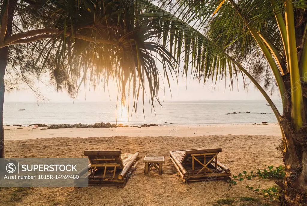 Thailand, Phi Phi Islands, Ko Phi Phi, sun loungers on the beach in backlight