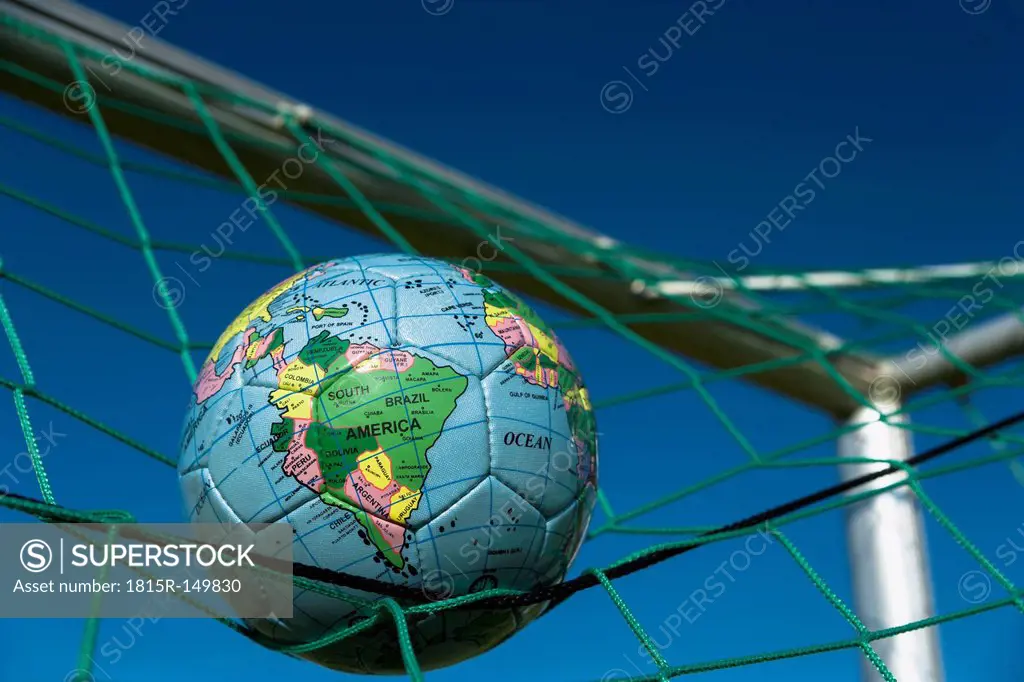 Soccer ball on soccer goal