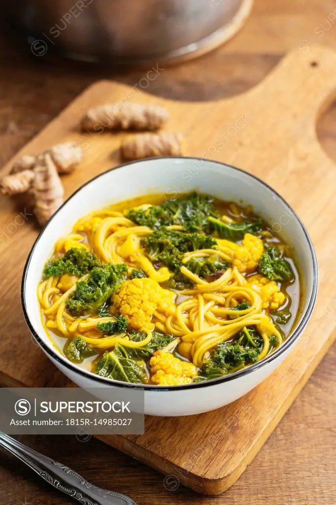 Turmeric broth, detox soup with soba noodles, kale, cauliflower and chickpeas