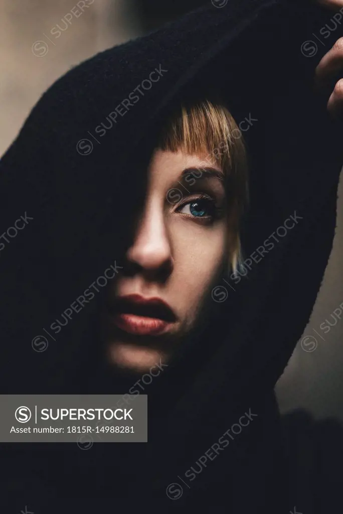 Portrait of woman with black hood