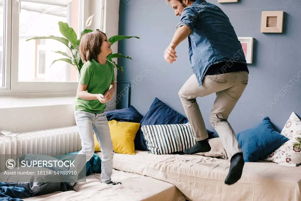 Playful father and son at home