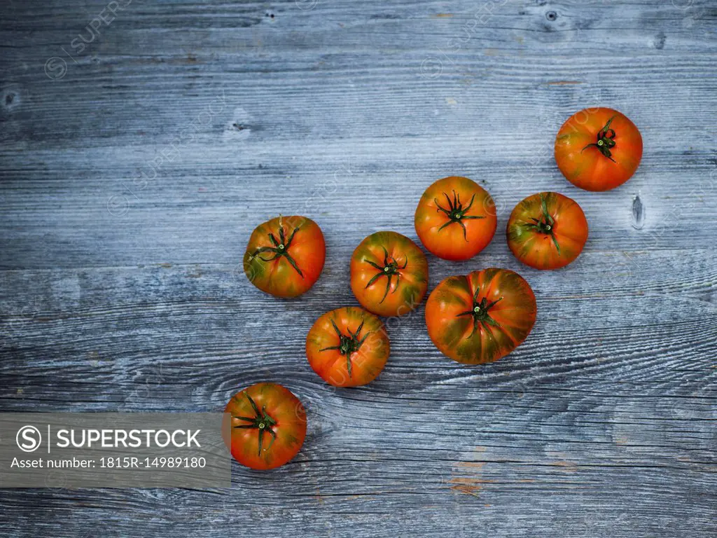 Kumato tomatoes on wood