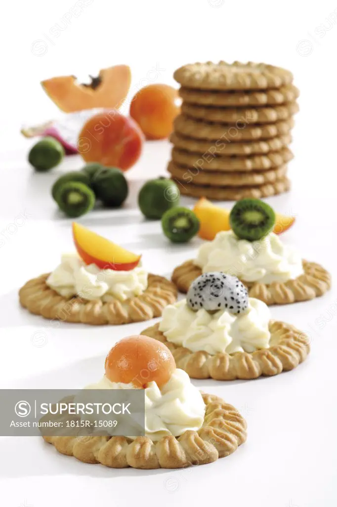 Tartelets with fruits and cream cheese, close-up