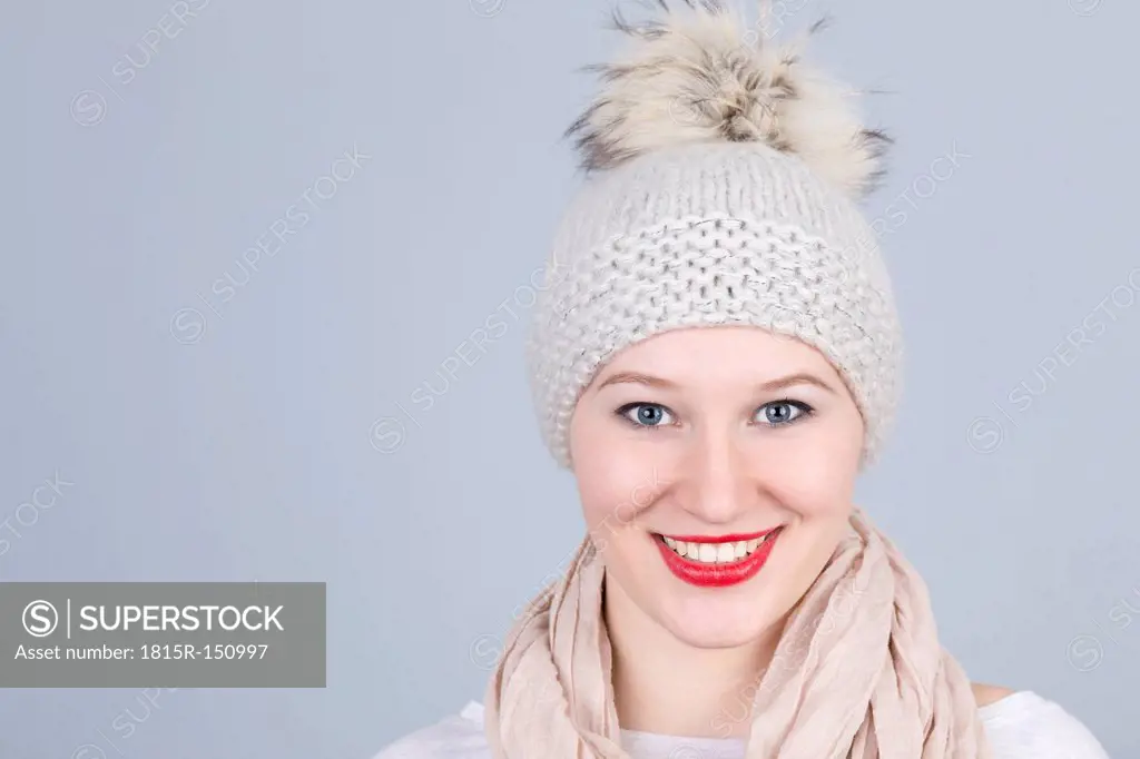 Portrait of young woman with bobble hat