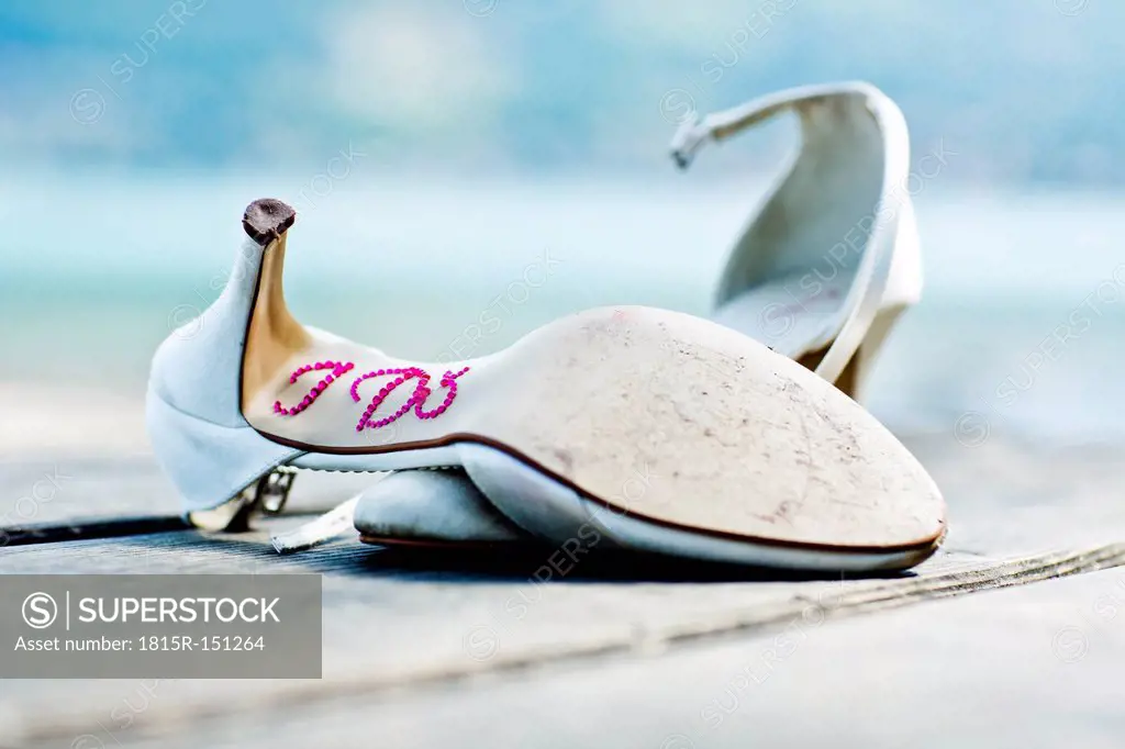 Germany, Bavaria, Tegernsee, Abandoned wedding shoes on jetty