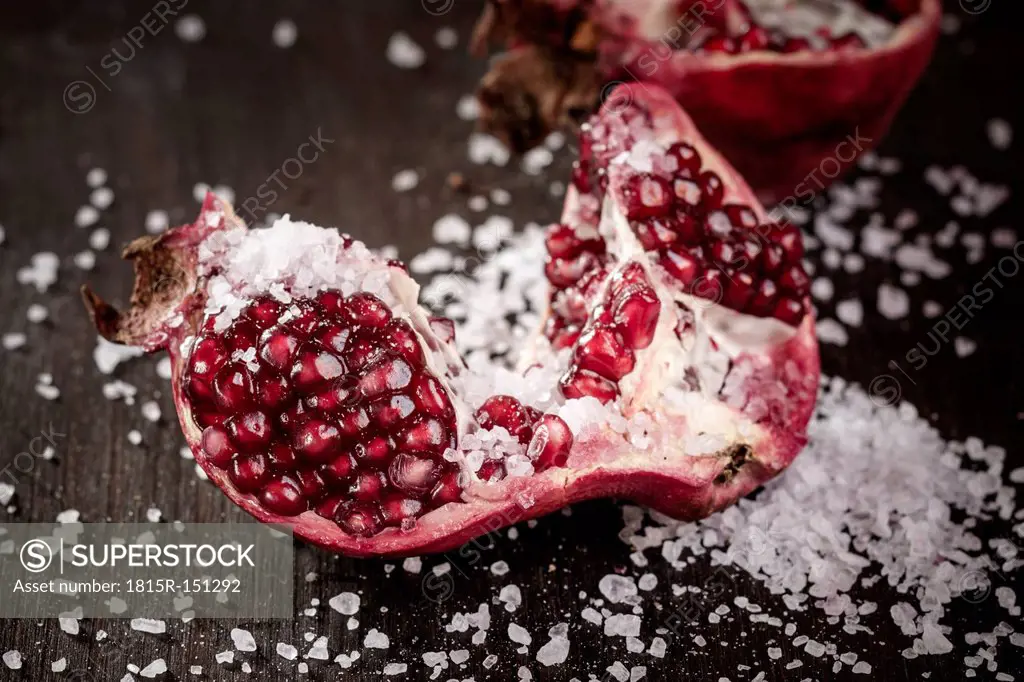 Opened pomegranate with corsican sea-salt, studio shot