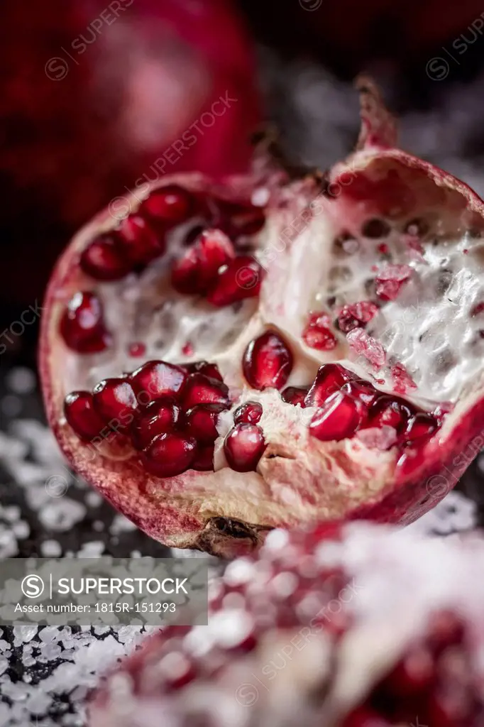Opened pomegranate with corsican sea-salt, studio shot