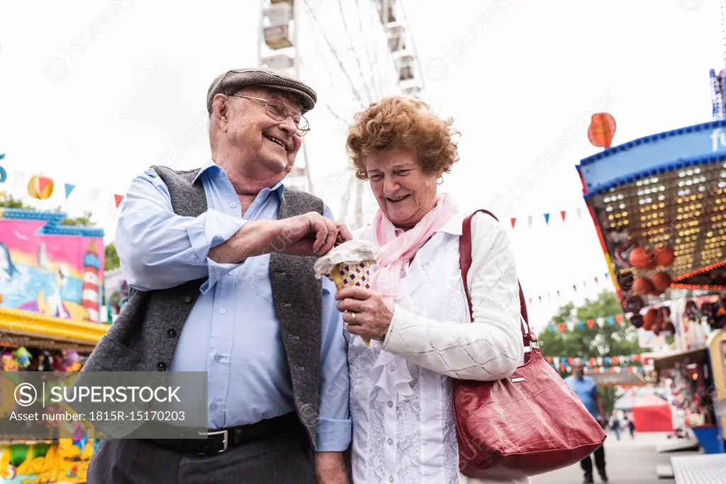 Senior couple having fun together on fair