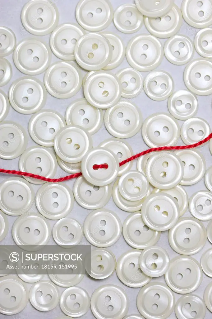 Pearl buttons, red thread