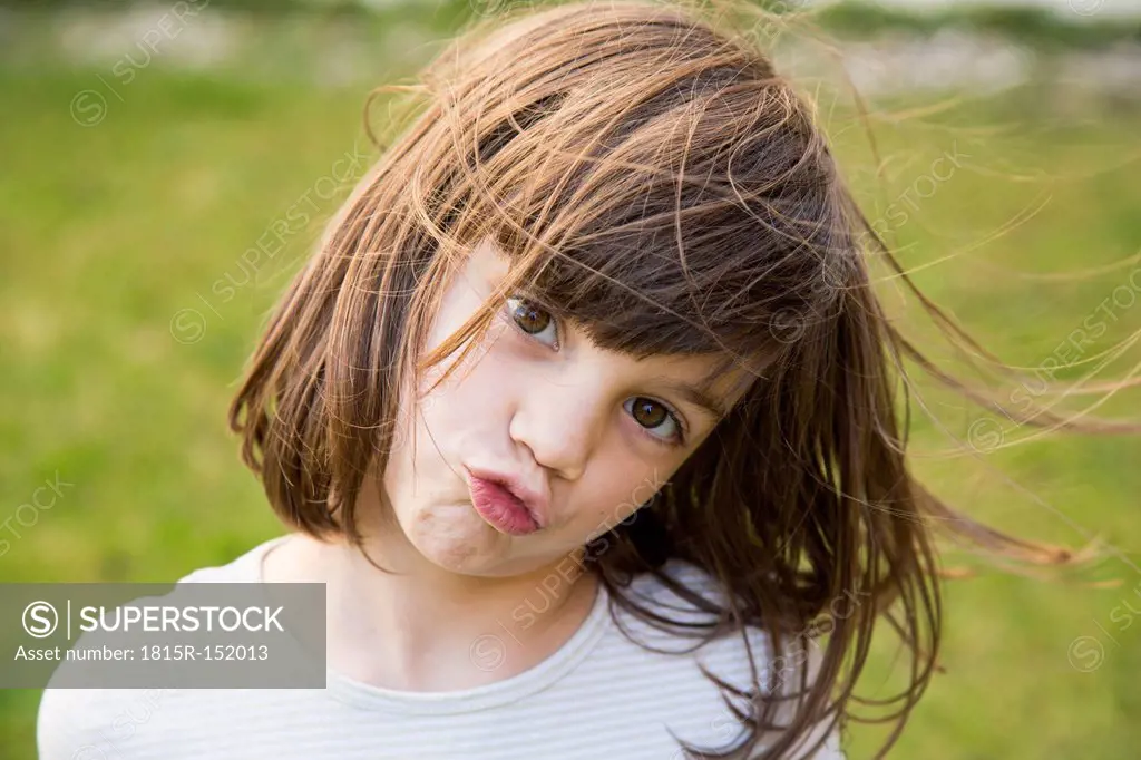 Portrait of little girl pouting