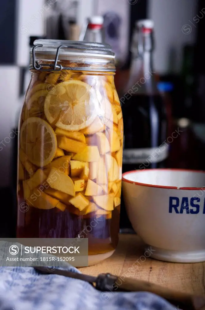 Jelly jar with selfmade quinces liqueur