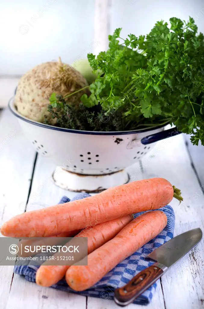 Carrots and vegetables on wodden table