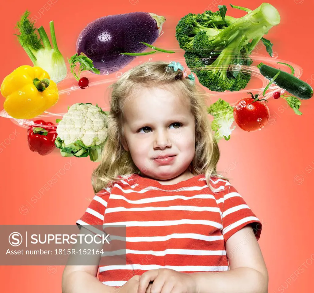 Little girl with flying vegetables around her head, Composite