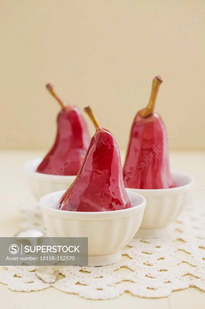 Poached pears in red wine in bowls