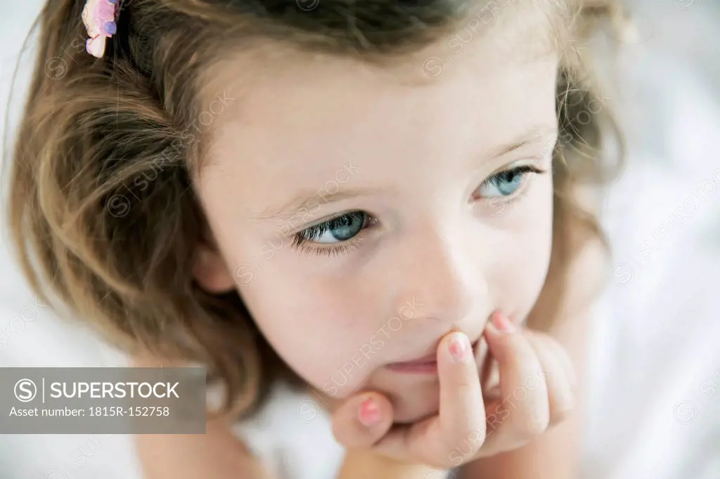 Portrait of thoughtful little girl, close-up