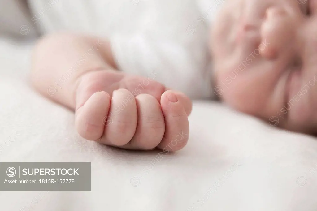 Little hand of sleeping male newborn, close-up