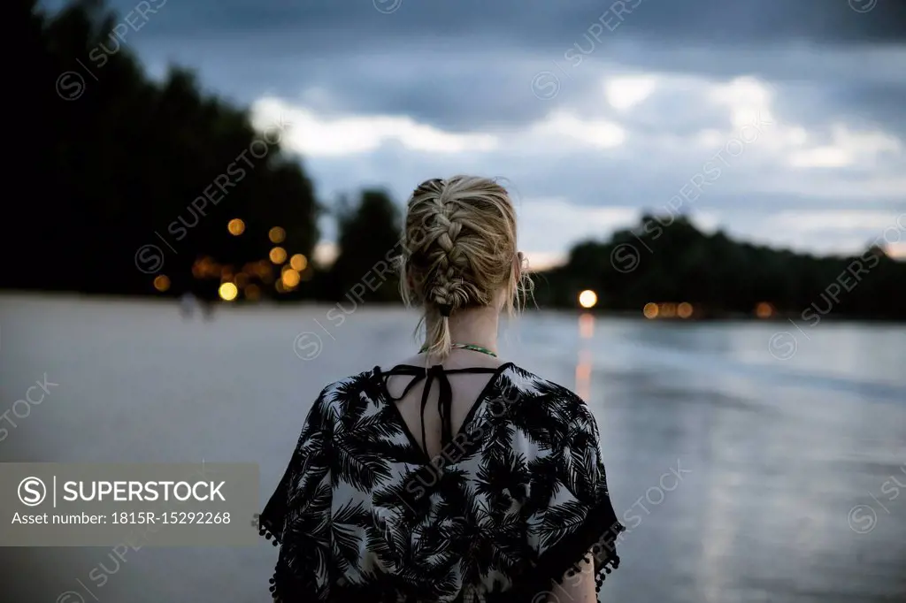 Thailand, Khao Lak, back view of woman on the beach at evening