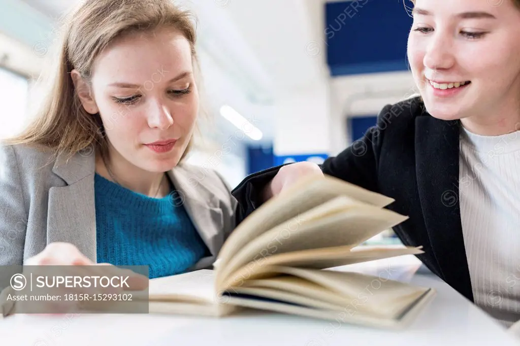 Portrait of teenage girls in a public library