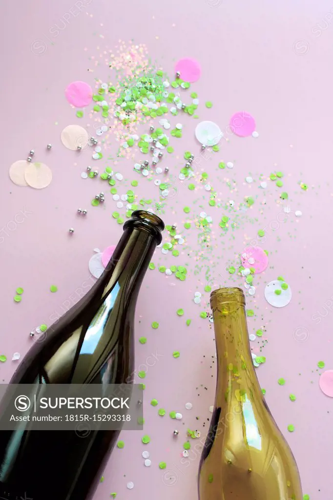 Stillife with champagne and wine bottle and confetti