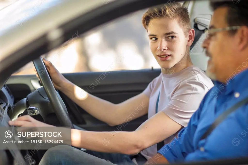 Learner driver with instructor in car