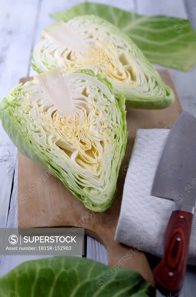 Pointed cabbage on wooden table