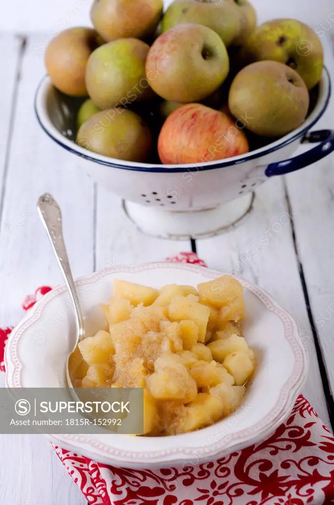 Homemade apple compote on wooden table