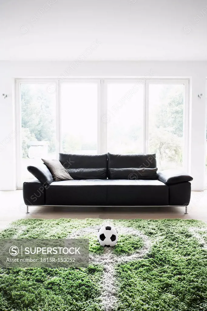 Germany, Cologne, Football field in living room