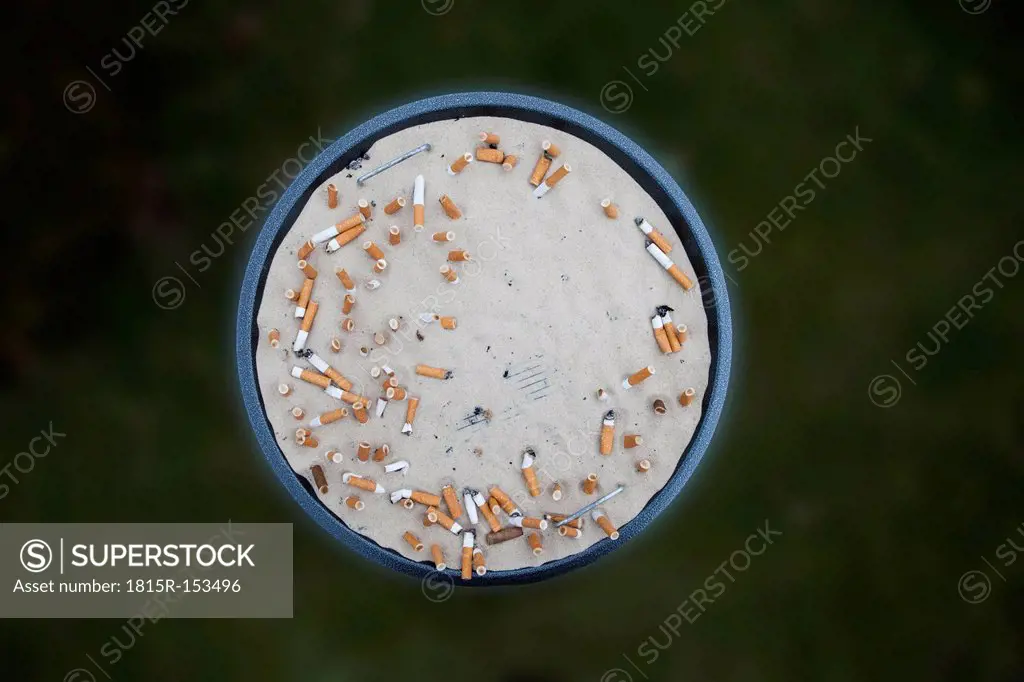 Outdoor ashtray with cigarettes and cigarette butts