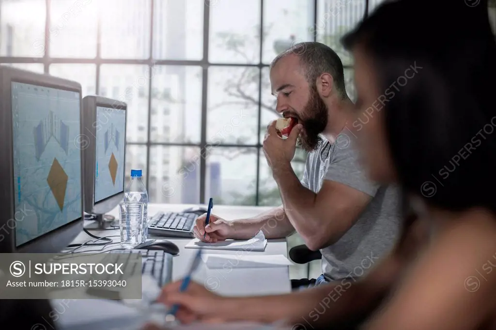 Adult Education, student eating an apple at computer training centre