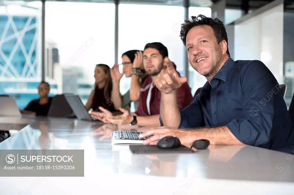 Business people sitting in conference room
