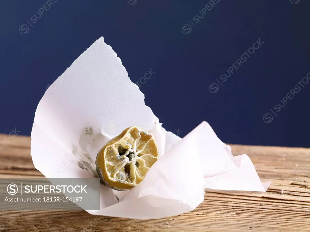 Rotting lemon in paper